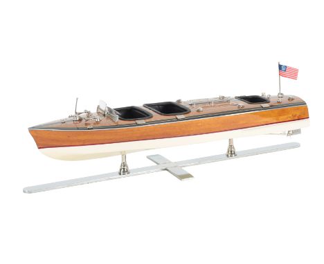 A RIVA STYLE MODEL SPEEDBOAT on a chromed metal base, the speedboat 64cm longProvenance: The Keith Walton collection. 