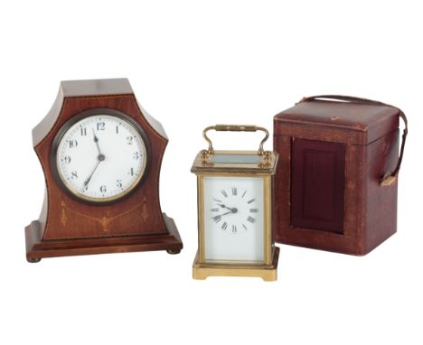 A VICTORIAN BRASS CASED CARRIAGE CLOCK 15cms high, including the swing handle, in a fitted leatherette traveling case, togeth
