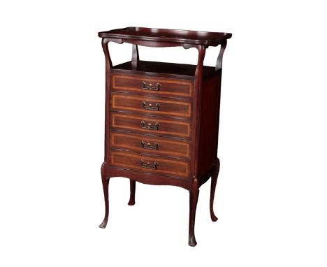 AN EDWARDIAN MAHOGANY MUSIC CHEST the shaped top with a moulded and raised edge, with five drawers beneath, each opening with