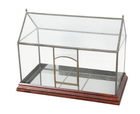 A VINTAGE LEAD AND GLASS TERRARIUM of architectural form, with a stained wood moulded base, 51cm high x 67cm wide x 37cm deep
