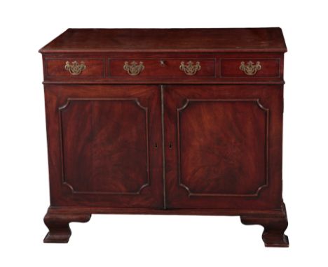 A GEORGE III MAHOGANY 'CUTLERY' CHEST the hinged top opening to a vacant interior, above three frieze drawers to the front, a