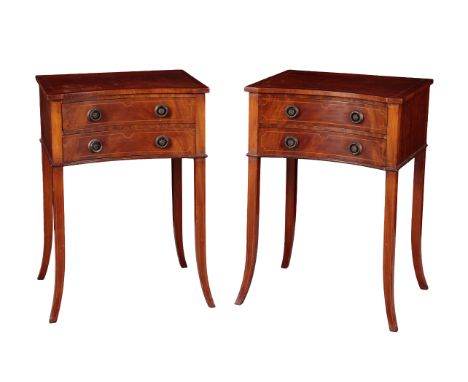 A PAIR OF EDWARDIAN MAHOGANY BEDSIDE TABLES with inverted bow fronts, the two short drawers above slender out turned legs, 66