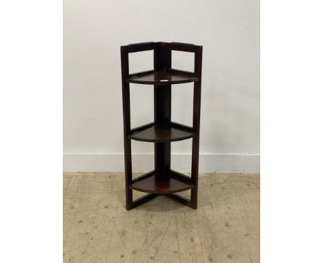 A stained oak three tier folding corner shelf unit, early 20th century H90cm.