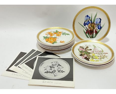 A set of twelve Franklin Porcelain plates with floral decoartiona and gilt edges (w- 23.5cm) with corresponding booklets&nbsp
