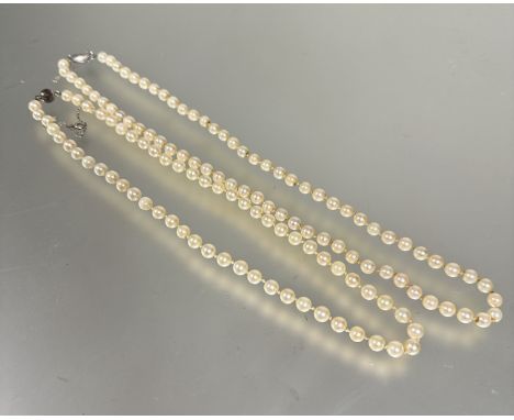 A cultured matched stand of pearls with magnetic clasp fastening, (L x 23 cm) and a cultured pearl matched strand of pearls w