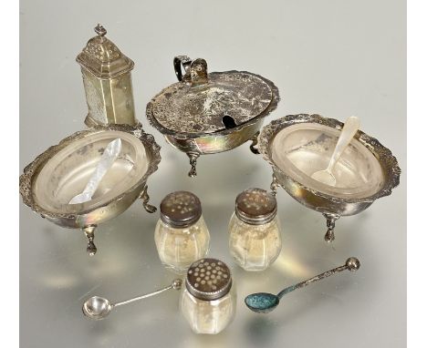 A Birmingham three piece part condiment set comprising a oval mustard with liner and a pair of matching salts with glass line