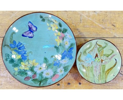 A Chelsea Pottery dish decorated with fruits, flowers and a butterfly (artist's signature and marked verso, h- 7cm, w- 28cm),
