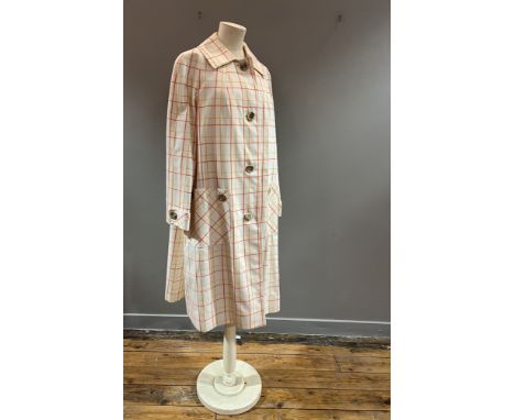 A 1970s Aquascutum lady's overcoat in cream with orange/yellow open line check (l.42" chest 40")