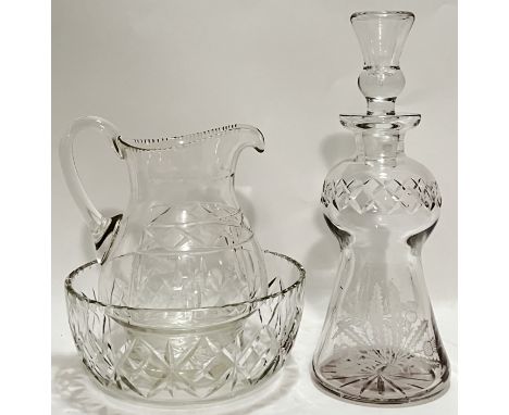 A cut crystal engraved glass thistle form decanter (h- 31.5cm), together with a cut crystal jug and basin (h- 22cm, w- 20cm) 
