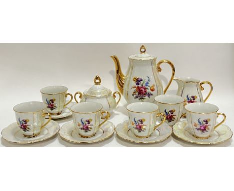 A Czechoslovakian gilt and lustre glazed part tea/coffee service comprising a coffee pot (h- 20.5cm, w- 18cm), a sugar bowl, 