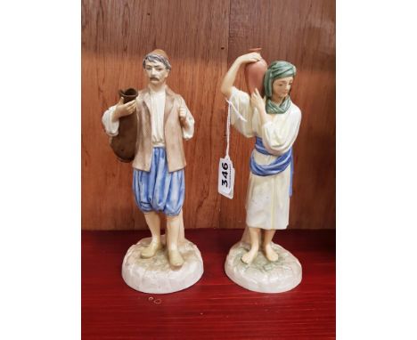 ROYAL WORCESTER PAIR OF EASTERN WATER CARRIERS MODELLED BY HADLEY