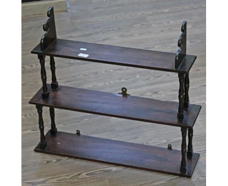 A 19th century mahogany three tier wall shelf or whatnot with turned uprights, width 67cm, depth 16cm & height 60cm.
