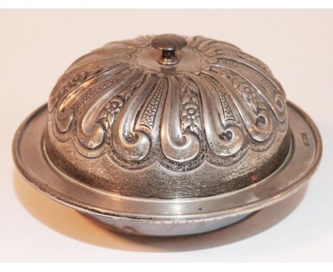 A silver muffin dish with embossed cover, William Hutton & Sons, Sheffield 1898, gross wt. 27oz.