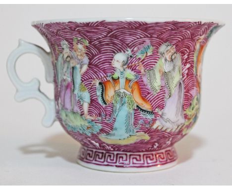 A Chinese porcelain cup decorated with figures and fish on purple fish scale ground, bat mark to base, height 7cm. CONDITION 