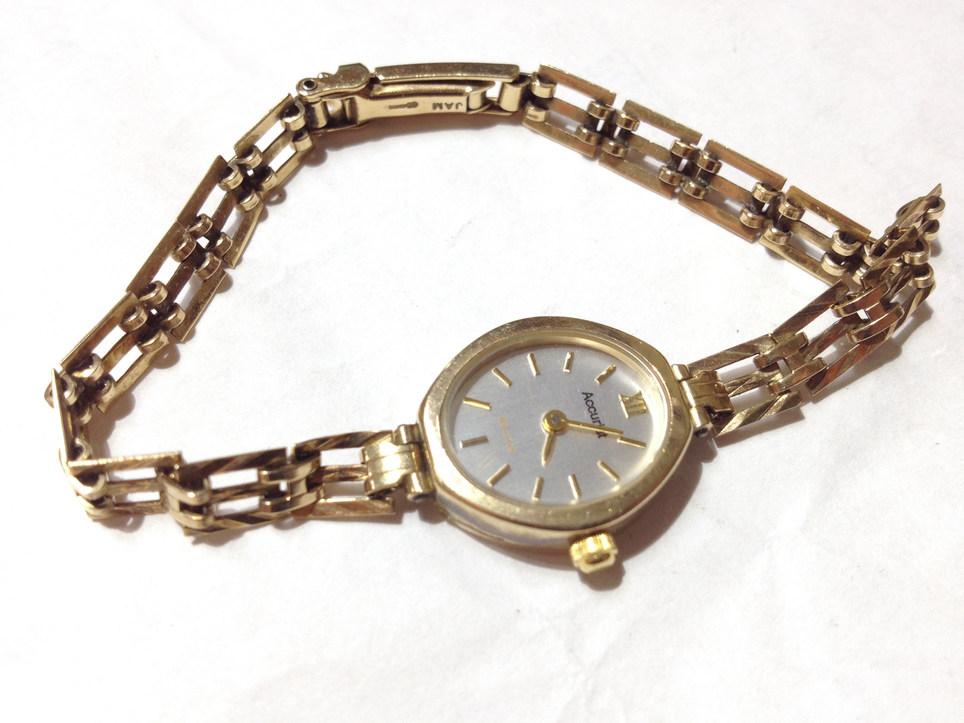 a-hallmarked-9ct-gold-accurist-wristwatch-with-hallmarked-9ct-gold