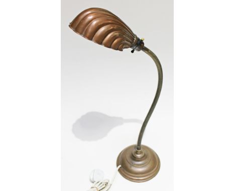 A weight copper lamp with coilled stem and half clam shade, the base stamp 'GEG'.