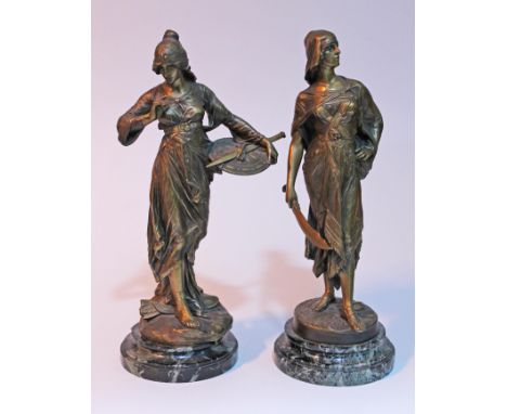 A pair of bronze figures formed as female soldiers on marble bases after Edouard Drouot, cast signatures, height 38cm each.