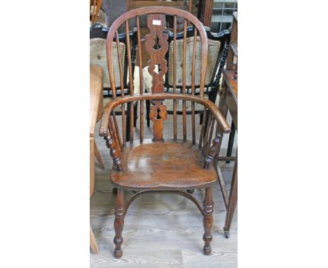 A 19th century ash Windsor chair with elm seat, width 54cm, depth 53cm & height 105cm.