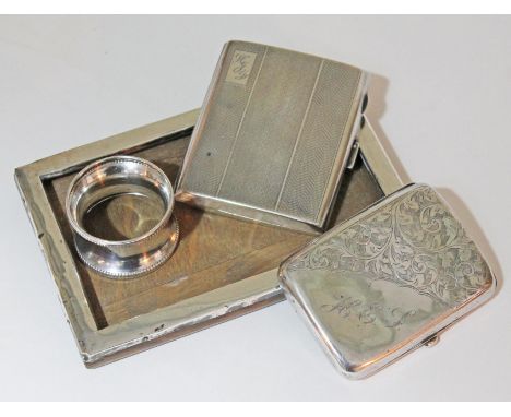 A mixed lot of hallmarked silver comprising a photo frame, a napkin ring and two cigarette case.