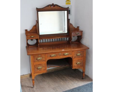 A Shapland and Petter arts and crafts pollard oak knee hole dressing table, the locks stamped 'S & P B', width 132cm, depth 5