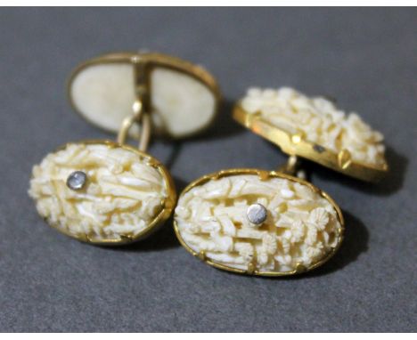 A pair of 19th Century Chinese Canton yellow mounted carved ivory cufflinks, gross wt. 4.7g.