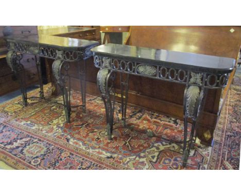 CONSOLE TABLES, a pair, iron framed, each with a D shaped faux marble top and leaf decoration, 88cm H x 111cm W x 43cm D. (2)