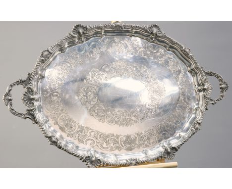 A LARGE VICTORIAN SILVER-PLATED TWO-HANDLED TRAY, by Harrison Bros &amp; Howson, oval, with shell and gadroon cast rim, engra