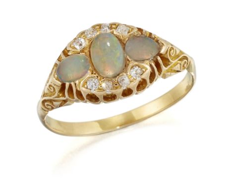 A VICTORIAN OPAL AND DIAMOND RING, three oval opals within a border of old-cut diamonds, to an open gallery and carved scroll