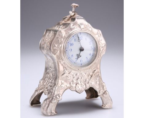 AN EDWARD VII SILVER MANTEL CLOCK,&nbsp;by&nbsp;William Comyns &amp; Sons, London 1903, the waisted case repousse with stylis