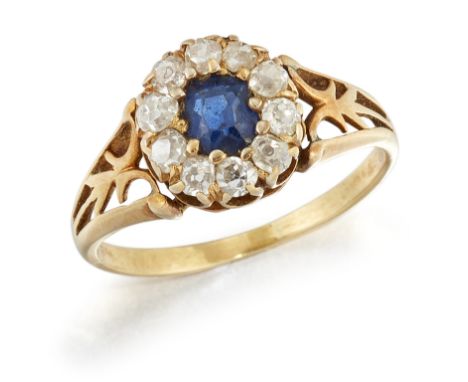 A 19TH CENTURY SAPPHIRE AND DIAMOND CLUSTER RING, an oval-cut sapphire in a claw setting within a border of eight-cut diamond