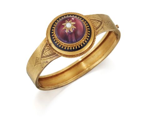 AN AMETHYST, SPLIT PEARL AND BLACK ENAMEL BANGLE, a round cabochon amethyst star set with a split pearl, within a beaded and 