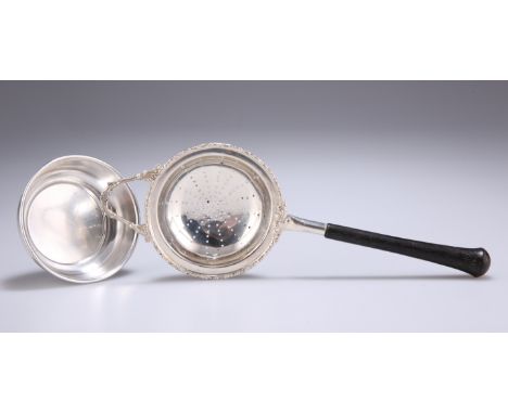 AN ELIZABETH II SILVER TEA STRAINER ON STAND,&nbsp;by&nbsp;Charles S Green &amp; Co Ltd, Birmingham&nbsp;1963 and 1968, the s