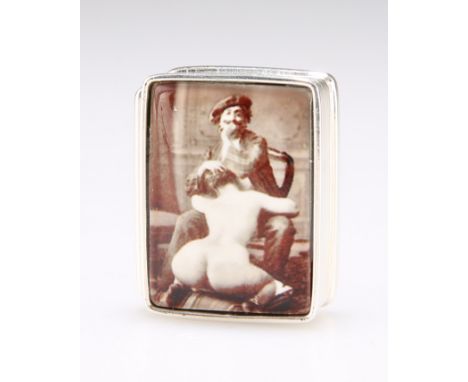TWO STERLING SILVER EROTIC PILL BOXES, each rectangular with hinged cover. 3cm wide, 1.2 troy ouncesThe absence of a Conditio