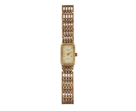 A LADY'S 9 CARAT GOLD ROTARY BRACELET WATCH, rectangular champagne dial with gilt baton index and hands, rope decoration to b