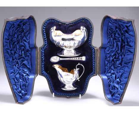 A VICTORIAN SILVER CREAM JUG, SUGAR BOWL AND TONGS,&nbsp;by&nbsp;Atkin Brothers, Sheffield 1894, the cream jug and sugar bowl