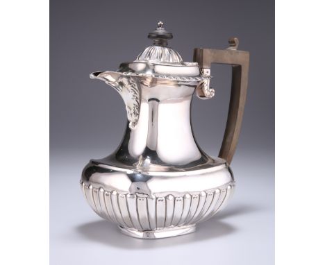 A LATE VICTORIAN SILVER HOT WATER JUG, by Elkington &amp; Co, Birmingham 1900, of squat form with half-gadrooned decoration a