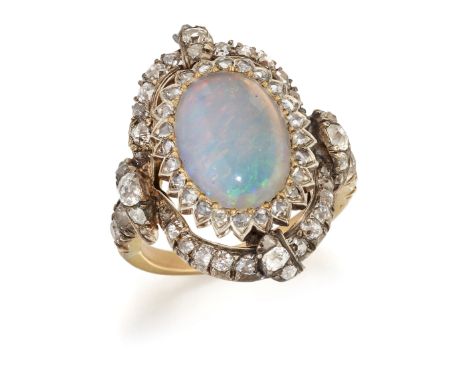 A LATE VICTORIAN OPAL AND DIAMOND CLUSTER RING, an oval-cut opal within a border of rose-cut diamonds, within a fancy halo fr