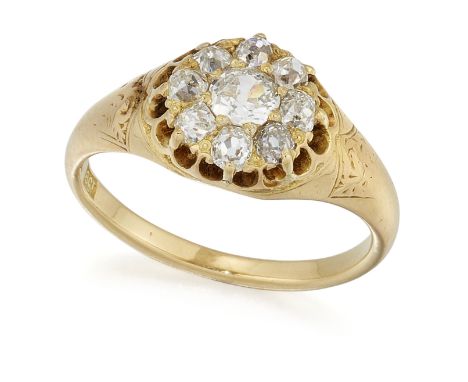 A DIAMOND CLUSTER RING, an old-cut diamond in a claw setting within a border of smaller old-cut diamonds, above an open galle