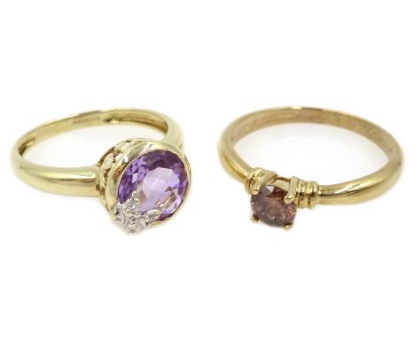 Gold round rim set amethyst and diamond butterfly ring and gold fancy cognac colour diamond solitaire ring, both hallmarked 9