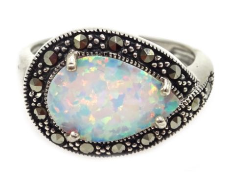 Silver opal and marcasite ring, stamped 925 Condition Report & Further Details Click here for further images, condition, auct