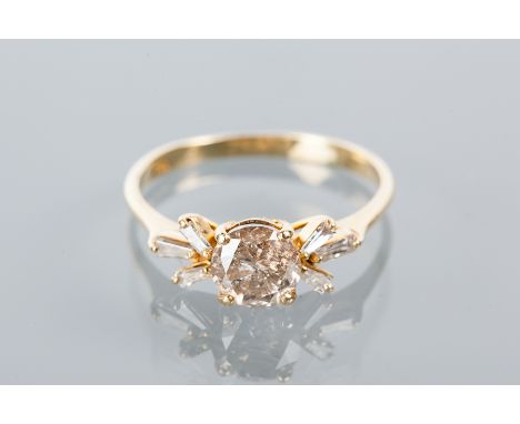 DIAMOND DRESS RING
the central brilliant cut diamond of approximately 1.26 carats, flanked by six tapered baguette cut diamon