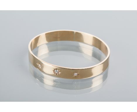NINE CARAT GOLD DIAMOND SET BANGLE
the old cut diamonds totalling approximately 0.25 carats, marked 375, 31.6g