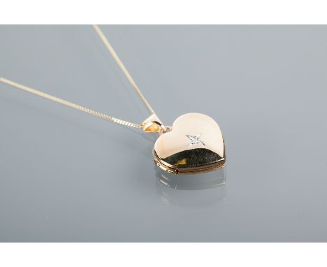 NINE CARAT GOLD HEART SHAPED LOCKET ON CHAIN
the locket set with a diamond in the centre, marked 375 for nine carat gold, cha