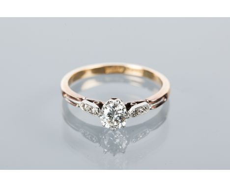 DIAMOND SOLITAIRE RING
the central brilliant cut diamond approximately 0.38 carats, on diamond shoulders, marked 18ct and PLA