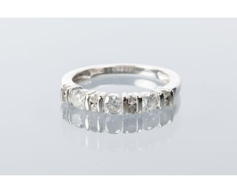 DIAMOND HALF ETERNITY RING
set with three brilliant cut diamonds separated by rows of two smaller diamonds totalling approxim