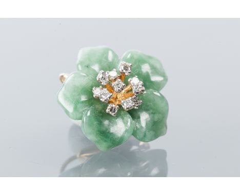 HARDSTONE AND DIAMOND PENDANT
in the form of a flower, the petals formed by green hardstone sections, possibly jade, set with