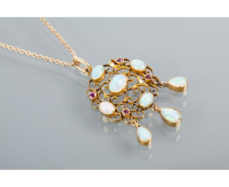 EDWARDIAN RUBY AND OPAL SET PENDANT
of pierced open work form, set with oval cabochon cut opals and round rubies, unmarked, o