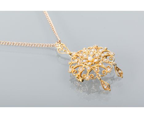 VICTORIAN PEARL PENDANT
of scrolling openwork form with two pearl set drops, marked 15ct for fifteen carat gold, on a nine ca