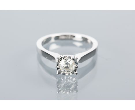 DIAMOND SOLITAIRE RING
the brilliant cut diamond approximately 0.34 carats, in an eighteen carat gold illusion setting, size 