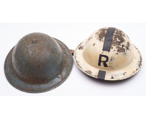 A WWII Mk I steel  'Rescue' helmet white with  black stripe and 'R' , together with a Mk III steel helmet in grey dated '1940